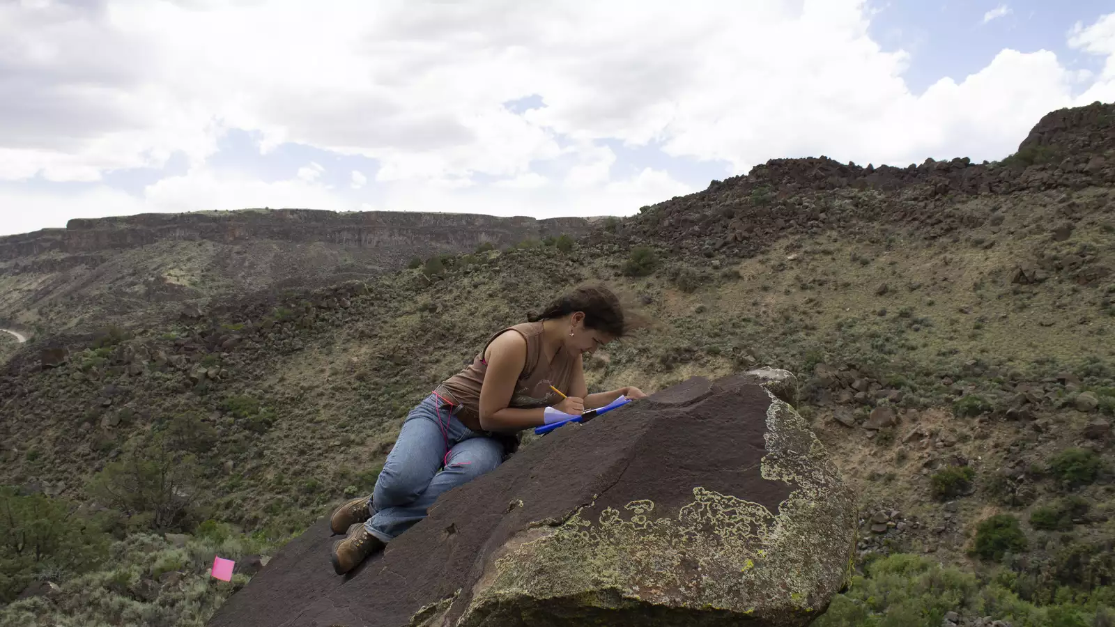 Student recording rock art