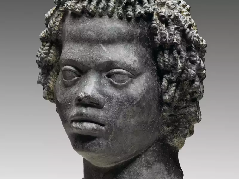 Head of a Man with Tight, Curly Hair, late 2nd century B.C.E. Marble, "Bigio Morata", 11 x 7 11/16 x 7 1/2 in. (28 x 19.5 x 19 cm). Brooklyn Museum, Charles Edwin Wilbour Fund, 70.59.